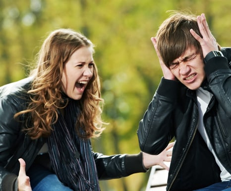Photo of teen girl yelling at teen boy